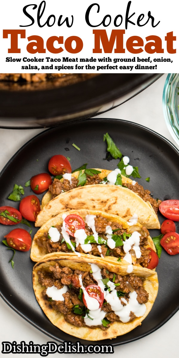 Pinterest pin with a plate of three beef tacos with cherry tomatoes and drizzled with sour cream, in front of a slow cooker full of slow cooker taco meat.