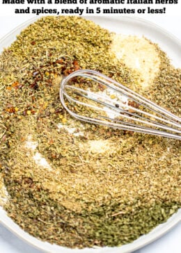 Pinterest pin with a whisk mixing together herbs and spices on a plate on a table.