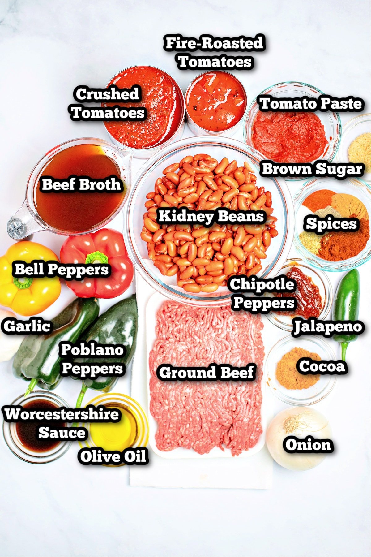 Individual ingredients for slow cooker chili on a table.