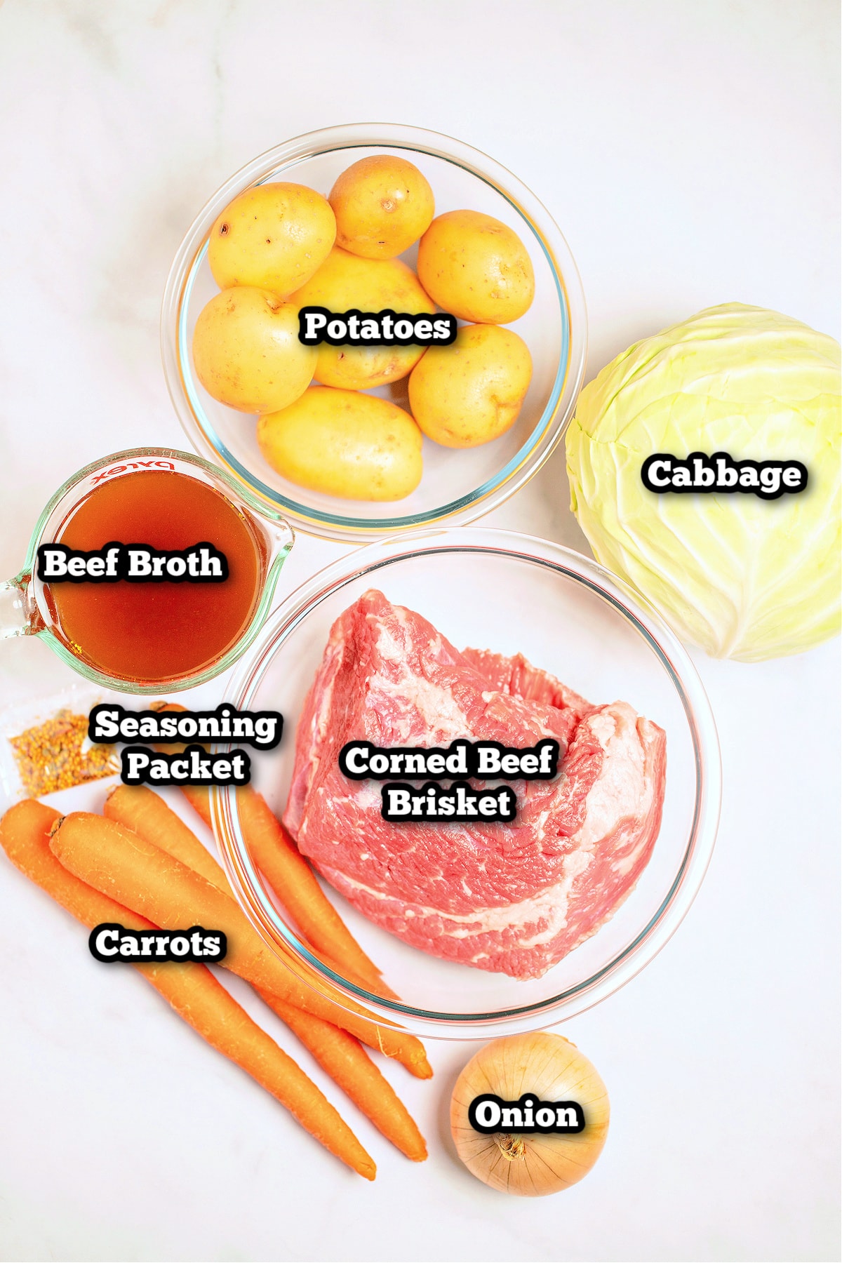 Individual ingredients for instant pot corned beef on a table.
