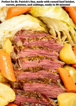 Pinterest pin with a closeup of sliced instant pot corned beef surrounded by potatoes, cabbage, and carrots.