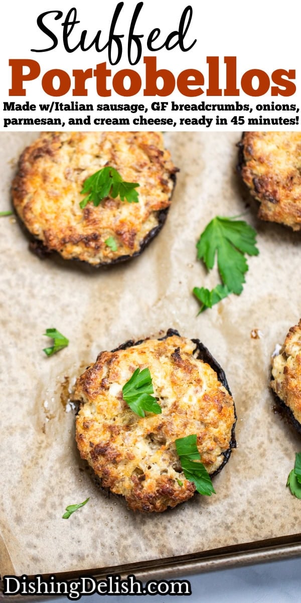 Pinterest pin with stuffed portobello mushrooms on a sheet pan with parchment paper, topped with fresh chopped parsley.