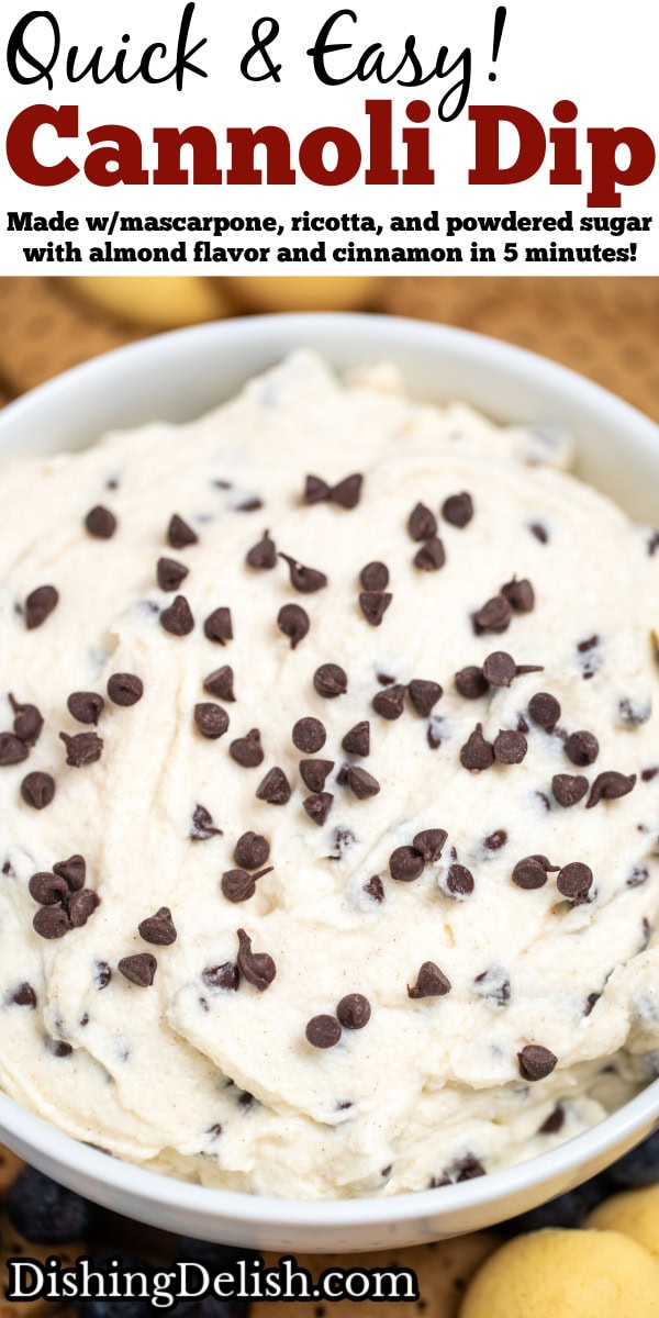Pinterest pin with a bowl of cannoli dip topped with mini chocolate chips. The bowl is sitting on a cutting board surrounded by graham crackers, blueberries, and vanilla wafers.
