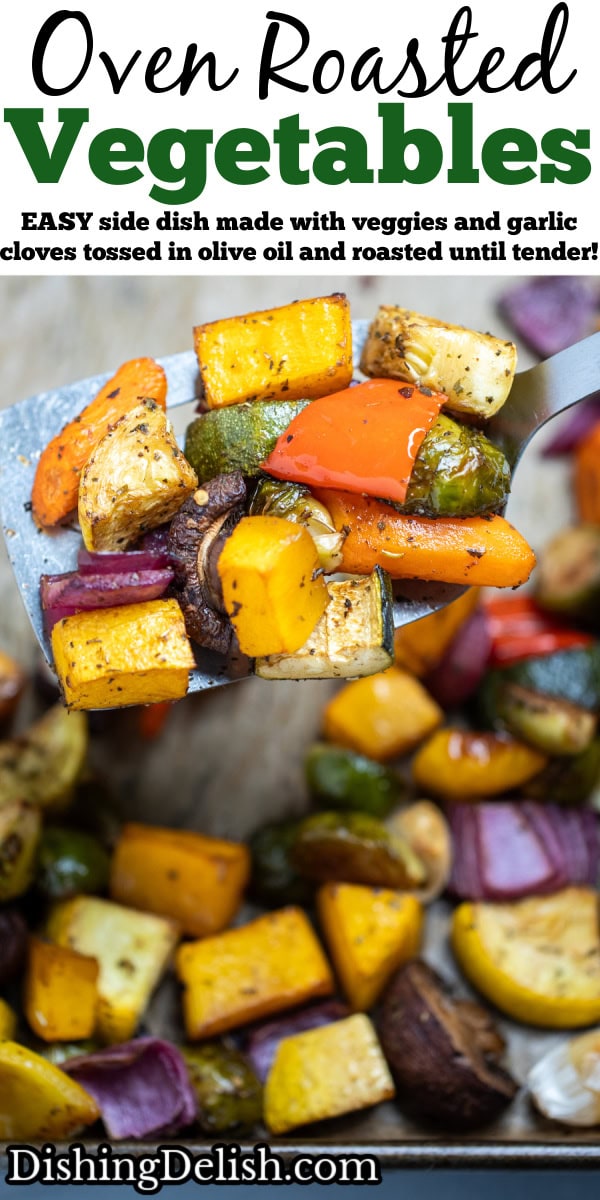 Pinterest pin with roasted vegetables on top of parchment paper on a sheet pan, with a spatula in the middle lifting some vegetables up, just out of the oven.
