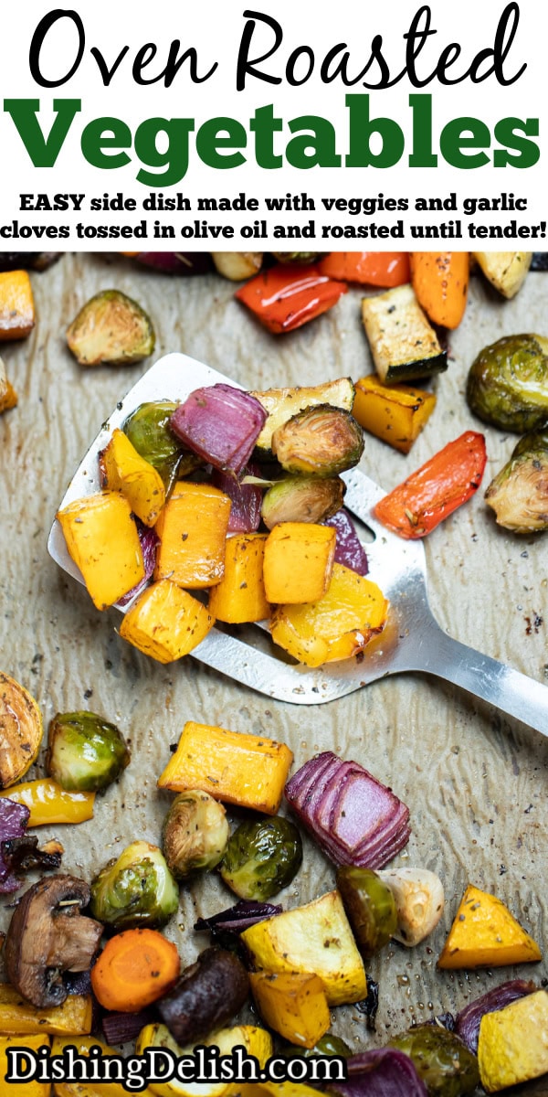 Pinterest pin with roasted vegetables on top of parchment paper on a sheet pan, with a spatula in the middle lifting some vegetables up, just out of the oven.