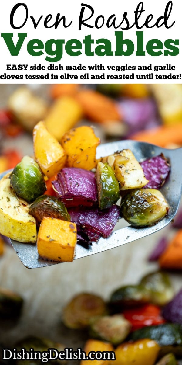 Pinterest pin with roasted vegetables on top of parchment paper on a sheet pan, with a spatula in the middle lifting some vegetables up, just out of the oven.