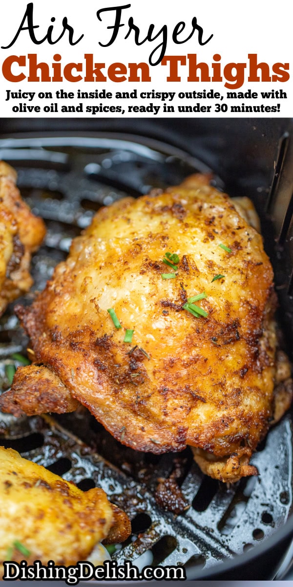 Pinterest pin with chicken thighs in an air fryer basket with chopped chives on top of crispy skin.
