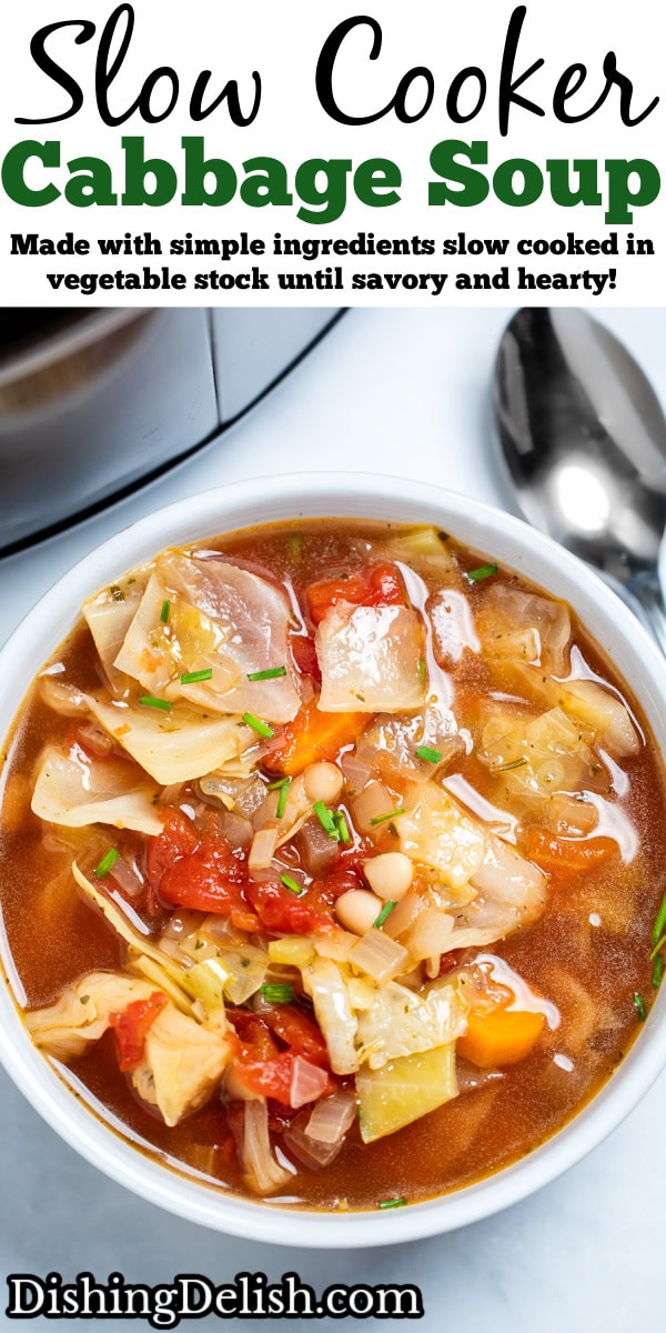 Pinterest pin with a bowl of slow cooker cabbage soup on the table, with a spoon next to the soup, in front of a slow cooker.