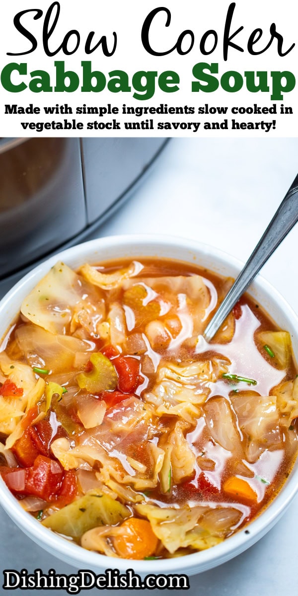 Pinterest pin with a bowl of slow cooker cabbage soup on the table, with a spoon in the soup, in front of a slow cooker.