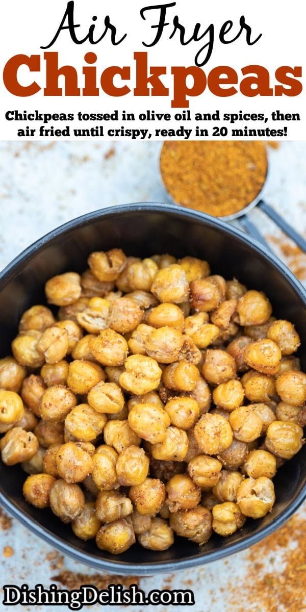 Pinterest pin with a bowl on a table with crispy air fryer chickpeas coated in seasoning, with a measuring cup of spices in the background.