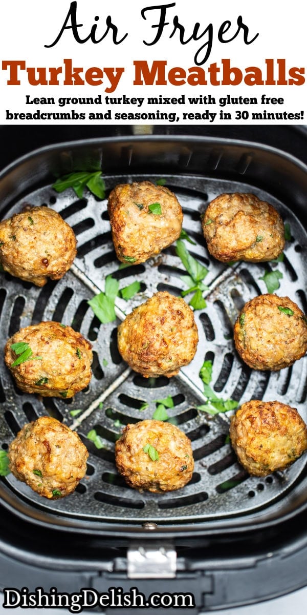 Pinterest pin with air fryer turkey meatballs in an air fryer basket after being cooked. They're brown and caramelized and topped with fresh parsley.