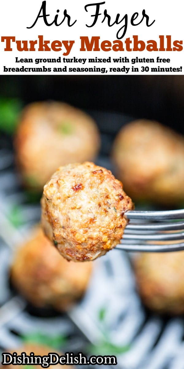 Pinterest pin with a fork holding an air fryer turkey meatball over an air fryer basket with other meatballs in the background.