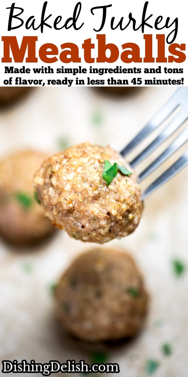 Pinterest pin with baked turkey meatballs on a sheet pan lined with parchment paper, fully cooked and topped with fresh chopped parsley, with a fork lifting one meatball up.