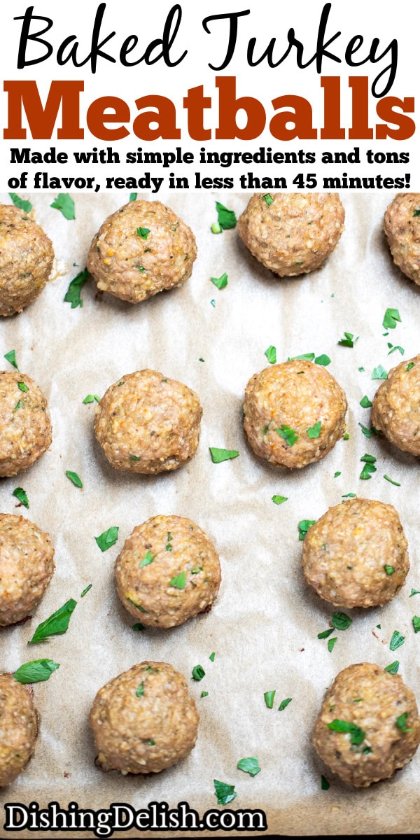 Pinterest pin with baked turkey meatballs on a sheet pan lined with parchment paper, fully cooked and topped with fresh chopped parsley.