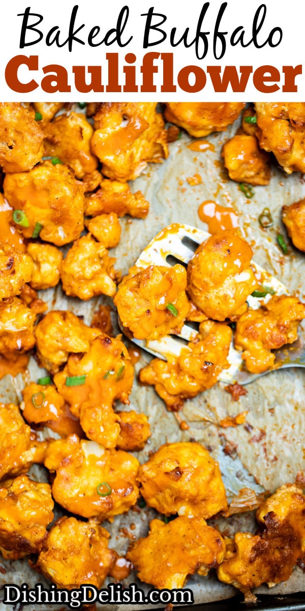 Pinterest pin with Buffalo Cauliflower Wings on a sheet pan lined with parchment paper and a spatula holding some cauliflower, resting on the sheet pan, topped with extra buffalo sauce and green onions.