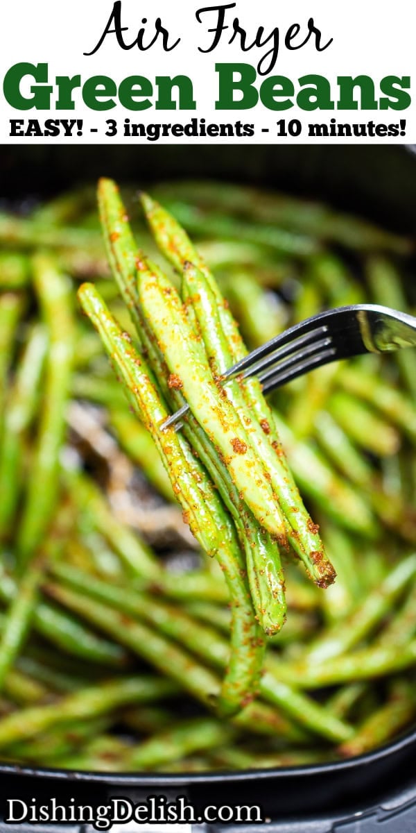 Pinterest pin with an air fryer basket with green beans air fried with olive oil and spices, with a fork holding some green beans up.