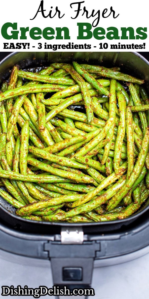 Pinterest pin with an air fryer basket with green beans air fried with olive oil and spices.