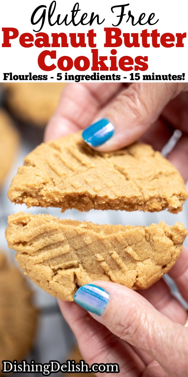 Pinterest pin with a hand breaking a peanut butter cookie in half over a rack of cooling cookies.