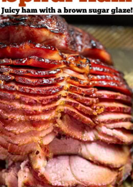 A pinterest pin with a spiral ham on a sheet pan, with layers of ham separated from each other.