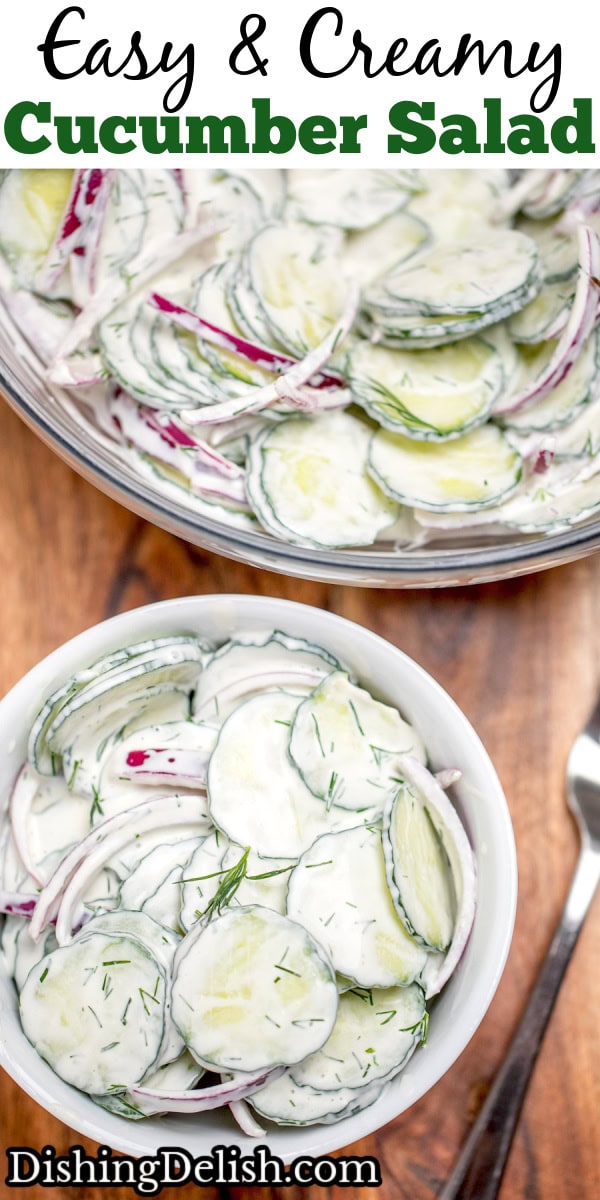 Pinterest pin with a glass mixing bowl on a cutting board full of creamy cucumber salad with red onions topped with fresh dill, with a bowl of cucumber salad in front with a fork resting next to the bowl.