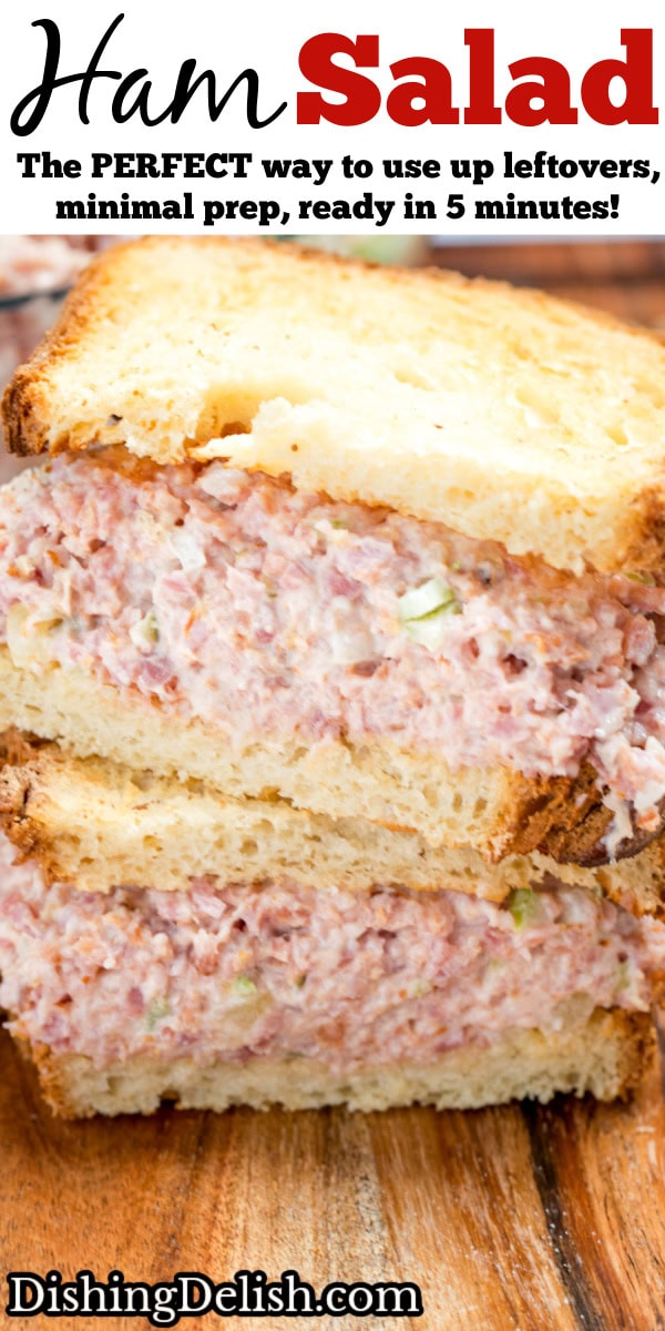 Pinterest pin with two halves of a ham salad sandwich with one half resting on top of the other, sitting on a wooden cutting board.