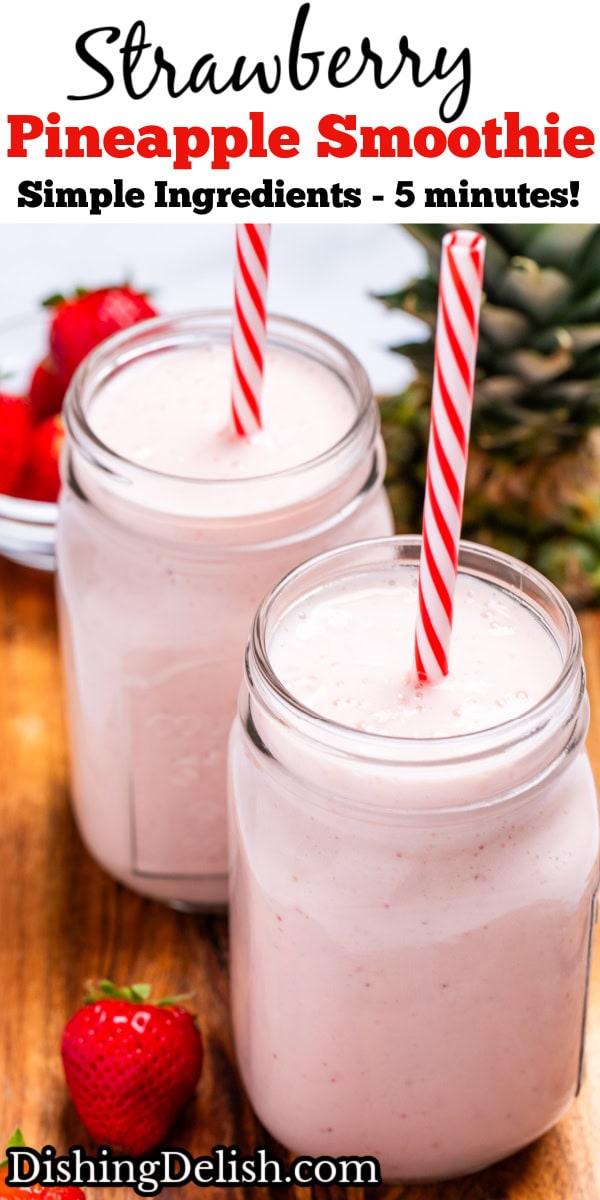 Pinterest pin with two mason jars sitting on a wooden cutting board with strawberry pineapple smoothie in them with a straw, next to strawberries and a pineapple top.