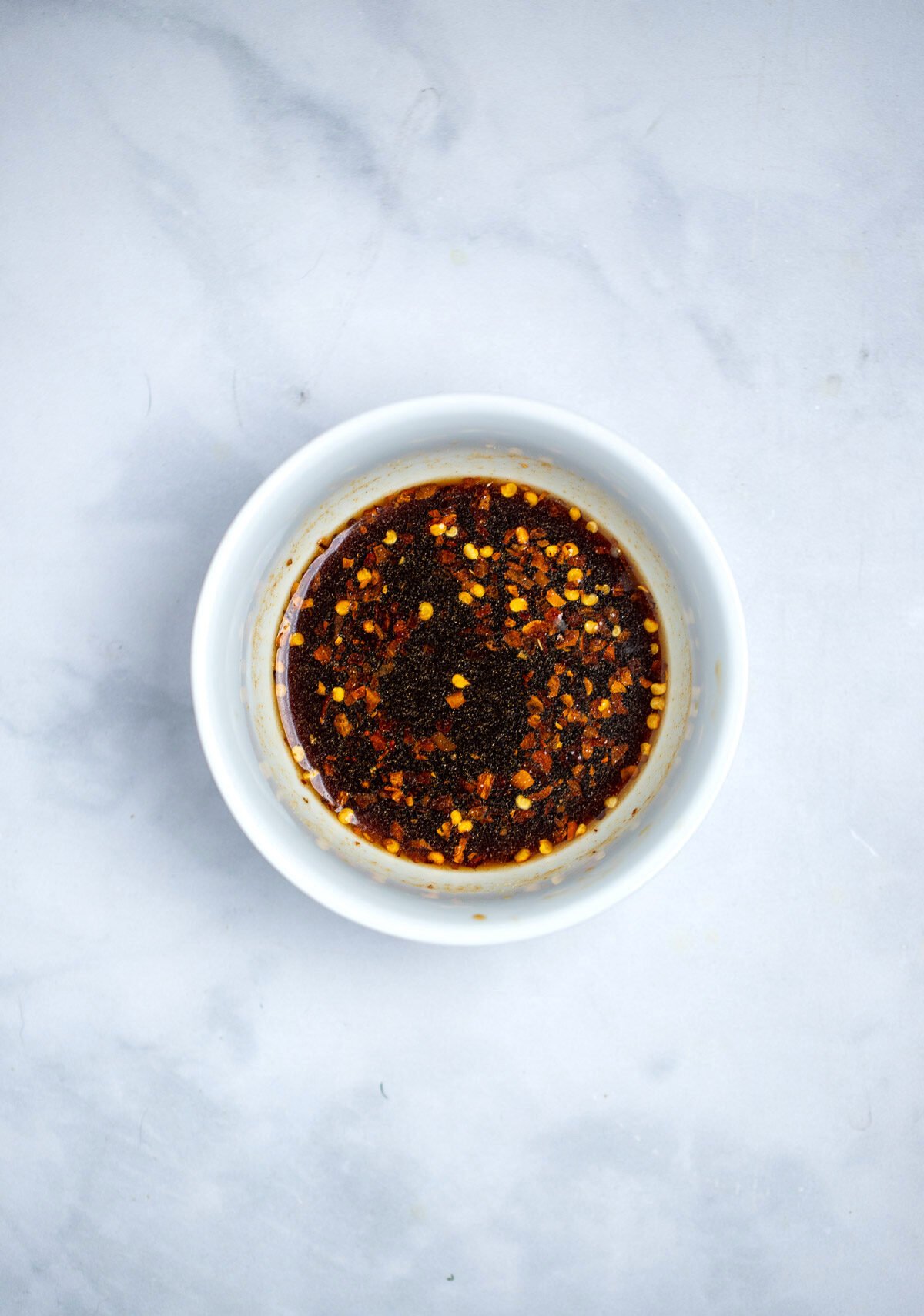A small bowl of korean beef seasoning whisked together.