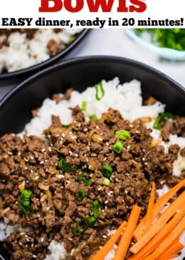 A pinterest pin with a bowl of rice topped with seasoned beef with raw carrot sticks and green onions, with another bowl and green onions in the background.