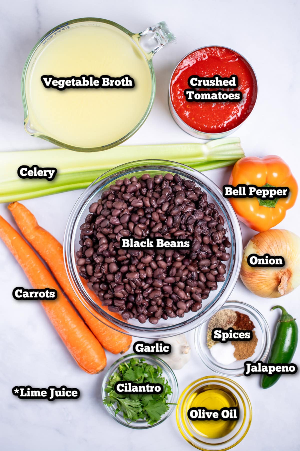 Individual ingredients for black bean soup on a table.