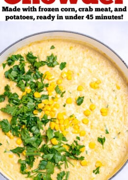 Pinterest pin with a dutch oven of crab and corn chowder topped with corn kernels and fresh parsley.