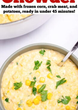 Pinterest pin with a bowl sitting on the table with crab and corn chowder topped with corn kernels and fresh parsley, with a spoon, and a dutch oven in the background.