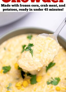 Pinterest pin with a bowl sitting on the table with crab and corn chowder topped with corn kernels and fresh parsley, with a spoon lifting some up, and a dutch oven in the background.