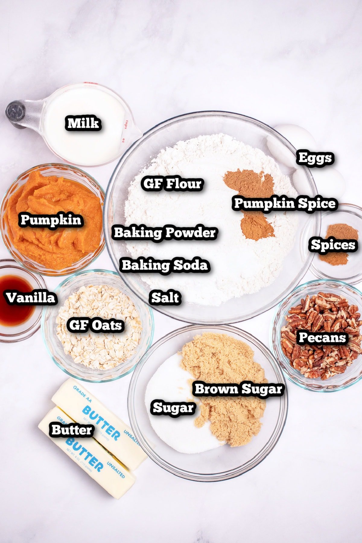Individual ingredients for pumpkin coffee cake on a table.