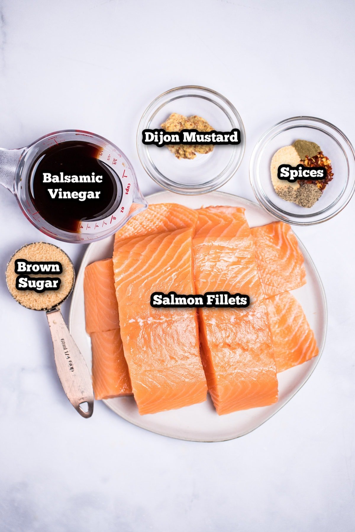 Individual ingredients for balsamic glazed salmon on a table.