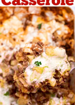 Pinterest pin with a spatula lifting some cabbage roll casserole out of a baking dish, topped with fresh parsley.