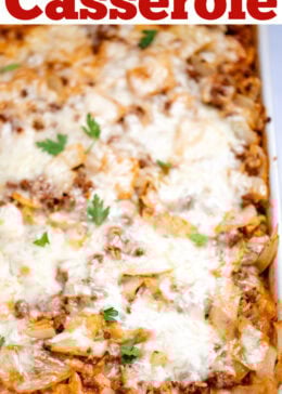 Pinterest pin with a casserole dish with Cabbage Roll Casserole topped with mozzarella cheese and fresh parsley before being served.