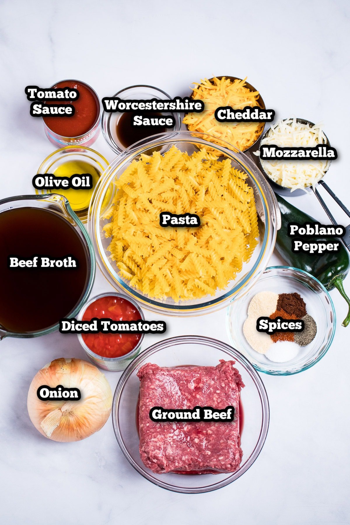 Individual ingredients for this cheeseburger casserole recipe on a table. 