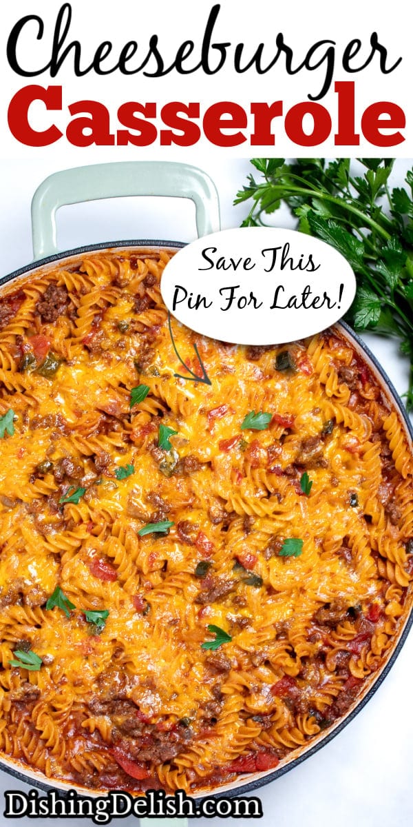 Pinterest pin with a cheeseburger casserole skillet with ground beef, gluten free rotini pasta, peppers, and onion topped with cheddar cheese and broiled, then topped with fresh parsley. There's fresh parsley on the table next to the skillet.