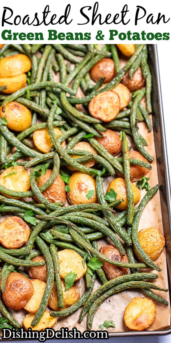 Pinterest pin with a sheet pan lined with parchment paper with roasted green beans and potatoes with olive oil and spices, topped with fresh parsley.