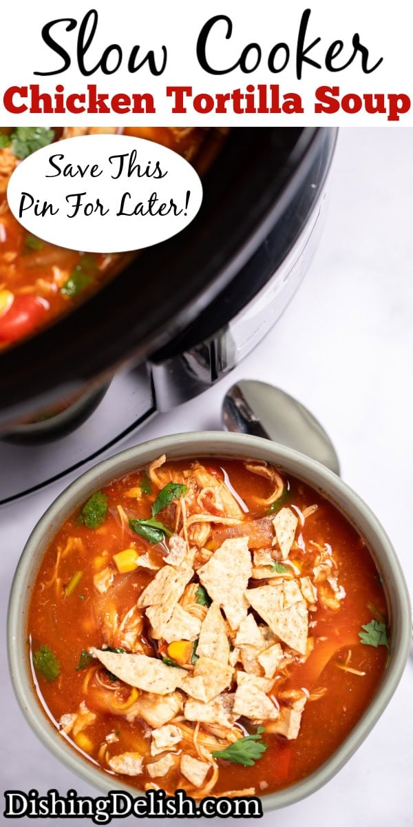 Pinterest pin with a bowl of chicken tortilla soup topped with fresh cilantro and crushed tortilla chips with a spoon on the table next to it, and the crockpot behind it.