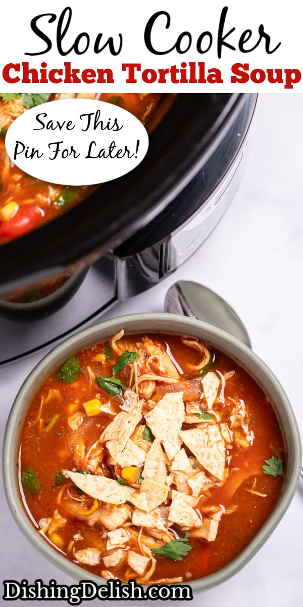 Pinterest pin with a bowl of chicken tortilla soup topped with fresh cilantro and crushed tortilla chips with a spoon on the table next to it, and the crockpot behind it.