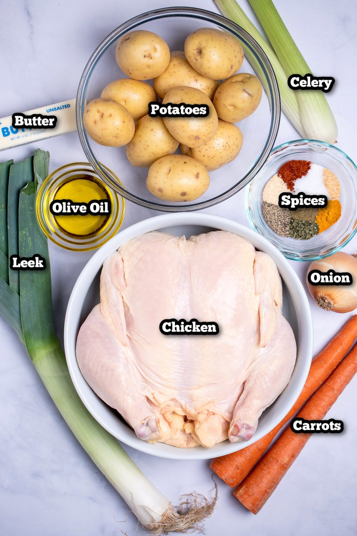 Individual ingredients for Slow Cooker Whole Chicken on a table.