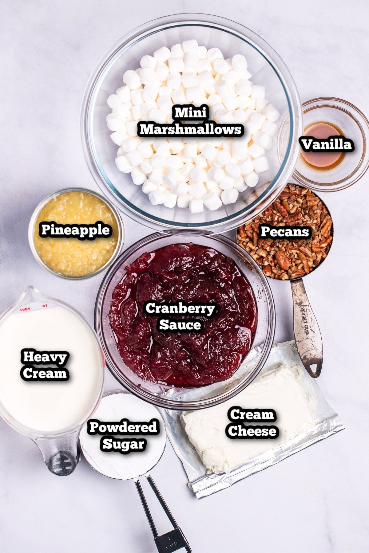 Individual ingredients for cranberry fluff salad on a table.