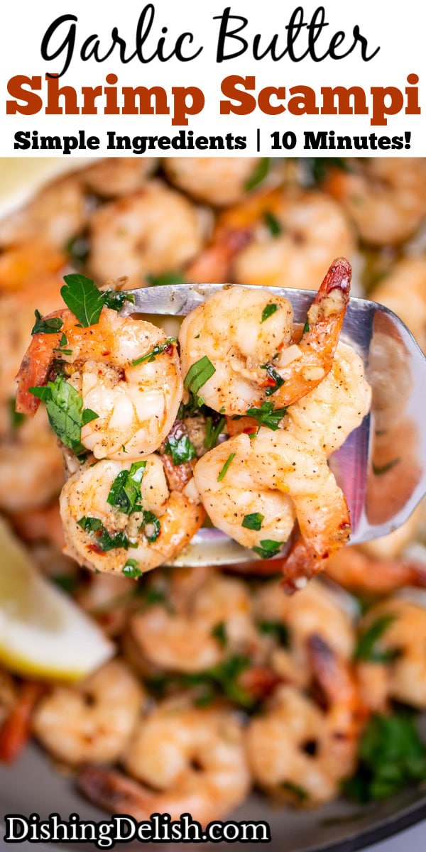 Pinterest pin with a nonstick skillet with cooked shrimp in garlic and butter with fresh parsley and two lemon wedges in the skillet, with a spatula lifting some up.
