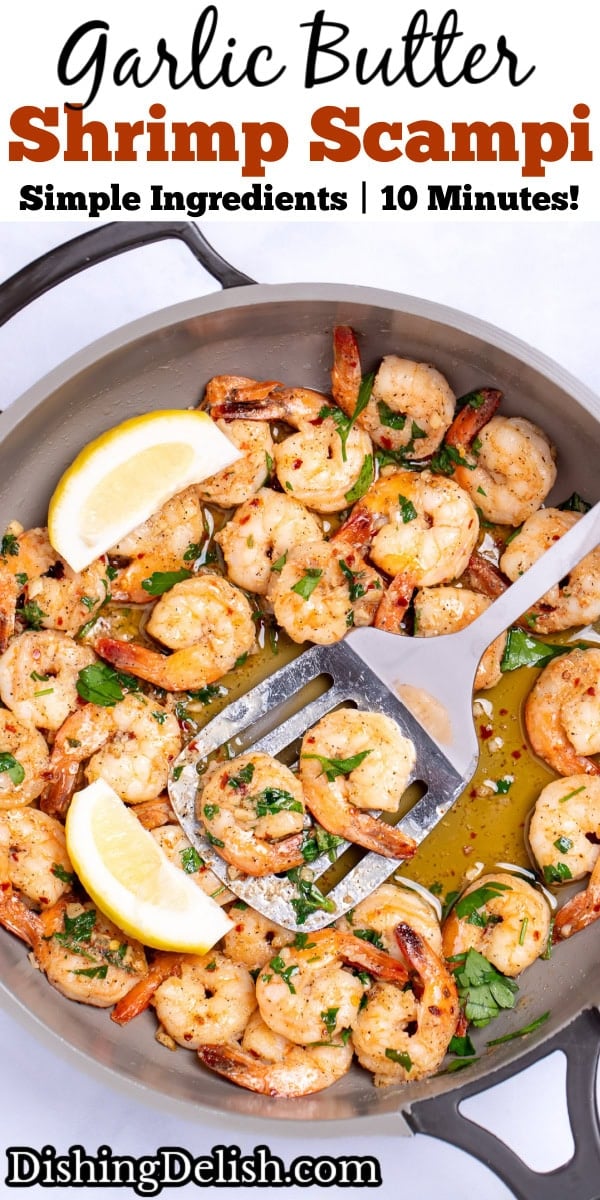Pinterest pin with a nonstick skillet with cooked shrimp in garlic and butter with fresh parsley and two lemon wedges in the skillet, with a spatula holding some shrimp and resting in the skillet.