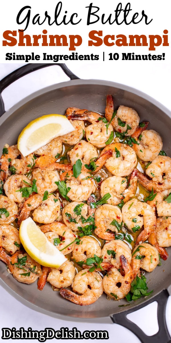 Pinterest pin with a nonstick skillet with cooked shrimp in garlic and butter with fresh parsley and two lemon wedges in the skillet.