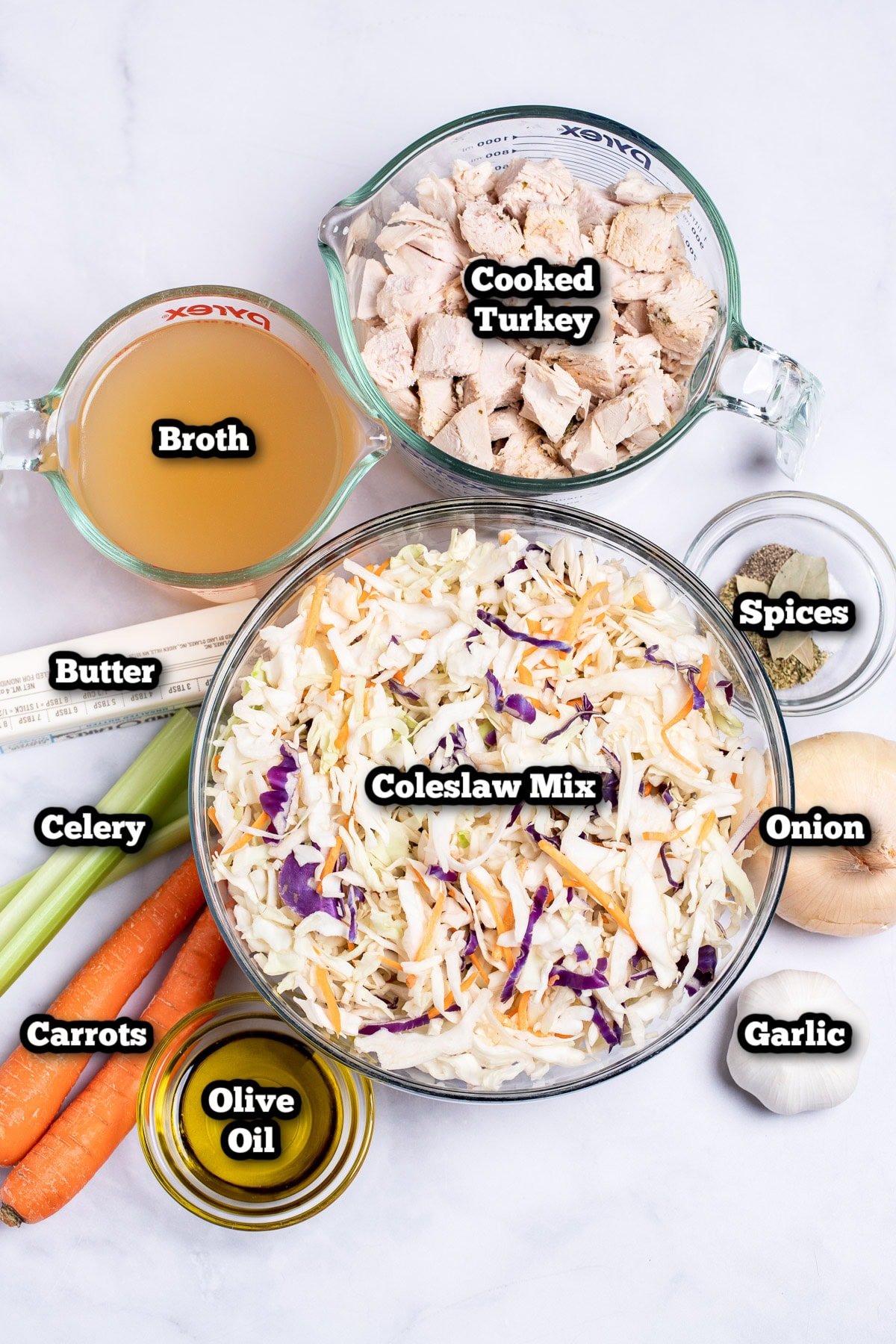 Individual ingredients for leftover turkey soup on a table.