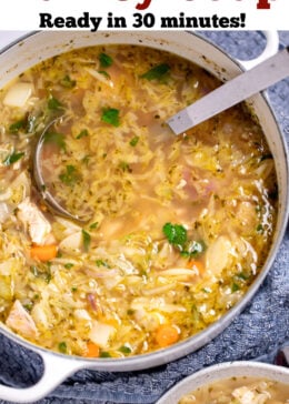 Pinterest pin with a dutch oven of leftover turkey soup with a ladle in it, and a bowl of soup topped with fresh parsley next to a spoon on the table in front of it.