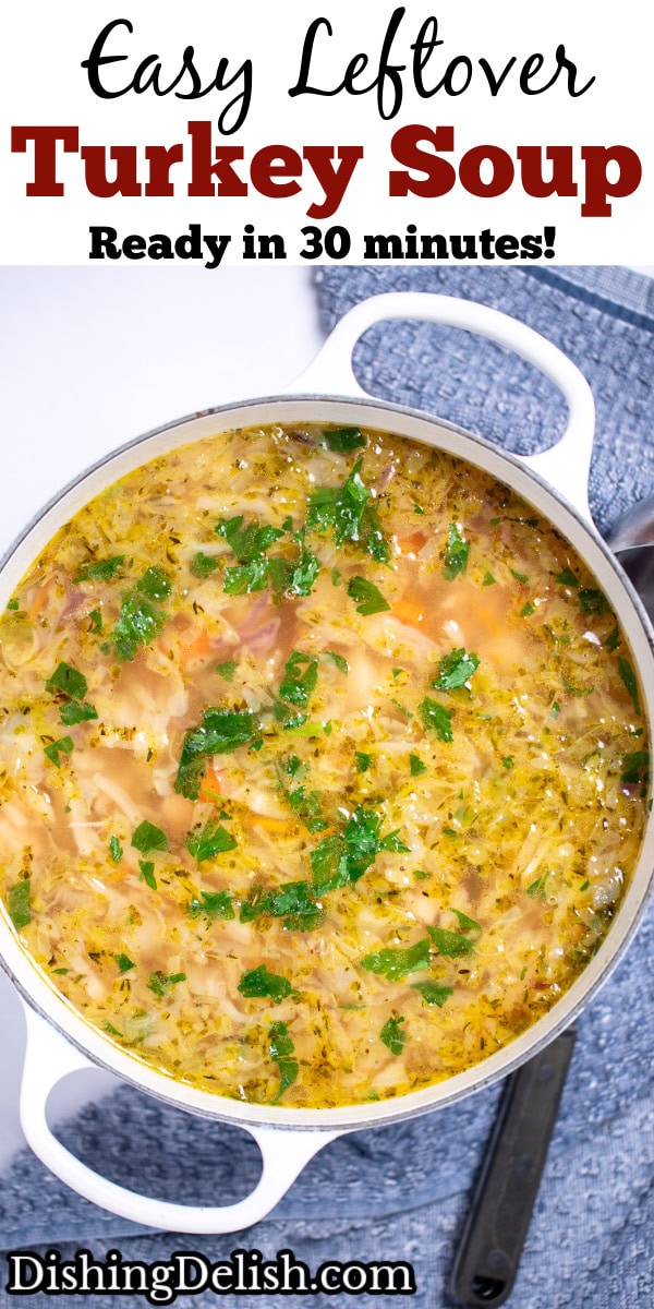 Pinterest pin with a dutch oven on a table with turkey soup topped with fresh parsley, next to a towel with a ladle on it on the table.