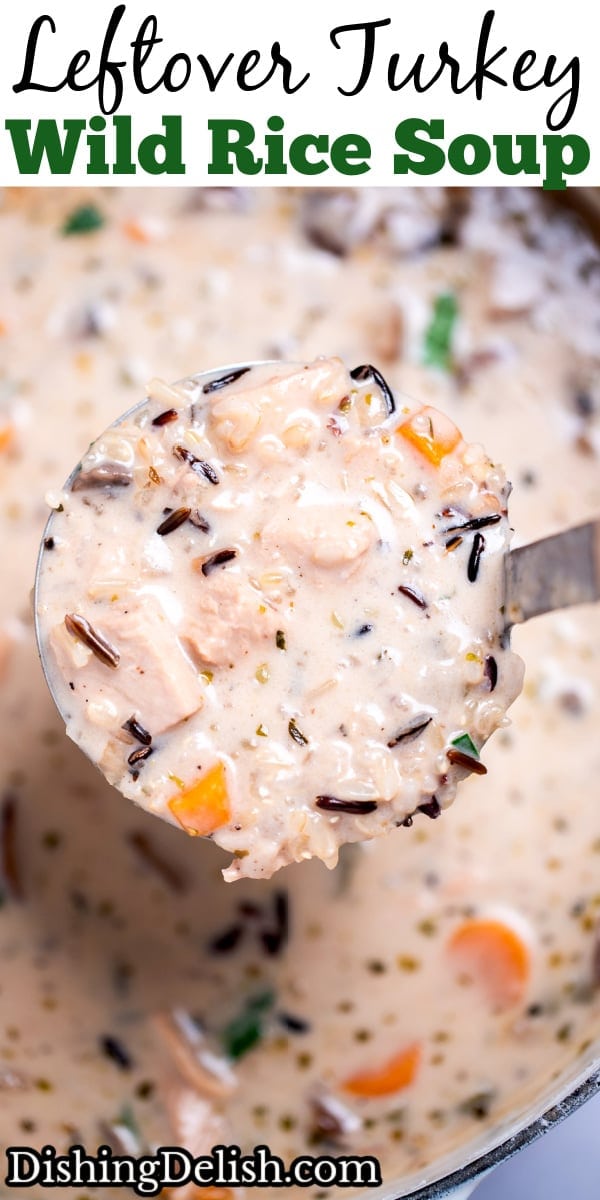 Pinterest pin with delicious homemade creamy leftover turkey and wild rice soup garnished with fresh parsley in a dutch oven, with a ladle lifting some up.